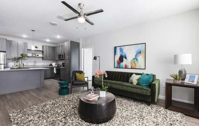 Open concept apartment  living room and kitchen at Residences at The Green in Lakewood Ranch, FL