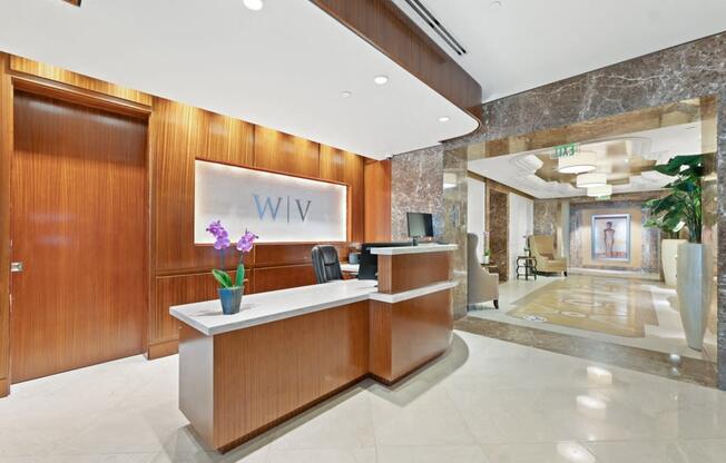 a lobby with a reception desk and a wii sign