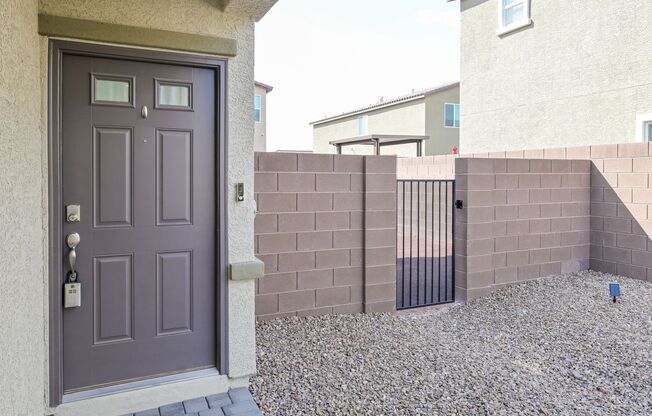NW!! Gated!! Built 2023!!!! Corner Lot!! Low Maintenance Desert Landscape Front!! Patio & Synthetic Grass in Back!! Pet Friendly!!