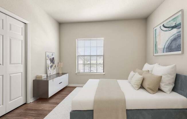 A bedroom with a bed, nightstand, and a window with blinds.