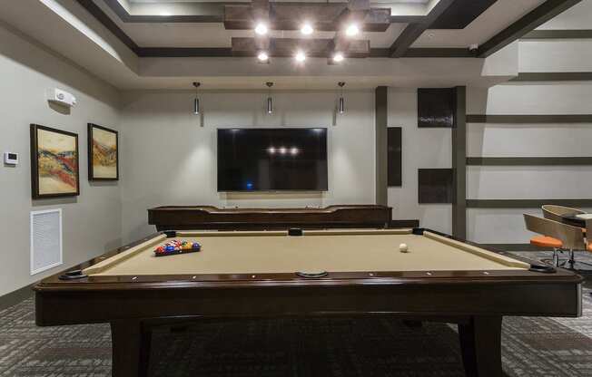 Pool tables and tv in rec room  at LandonHouse in Lake Nona