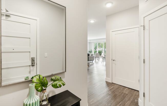 a hallway with white doors and a mirror at Barrington 101, Illinois, 60010