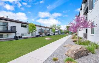 the preserve at ballantyne commons apartment community walkway with trees and houses