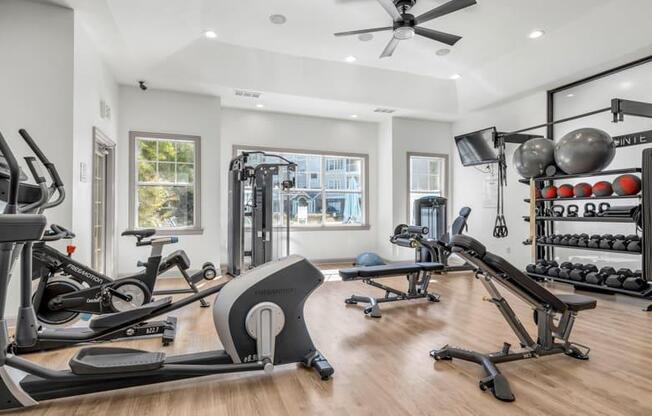 a home gym with exercise equipment and a mirror at Marina Point, Tennessee