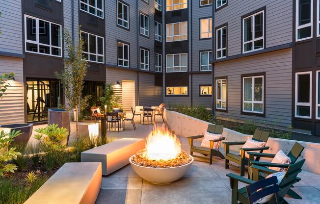 Gather around the inviting fire table on cool evenings or relax amidst vibrant greenery in ample comfortable seating.