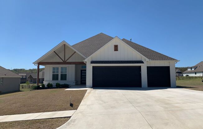 Beautiful home tucked in the rolling wooded hills of Catoosa