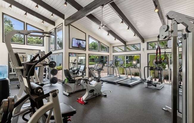 the gym with exercise equipment and windows