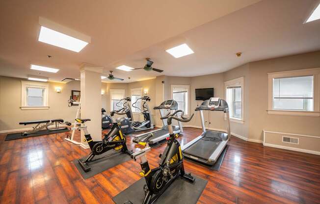 Spacious onsite gym with a variety of exercise equipment.