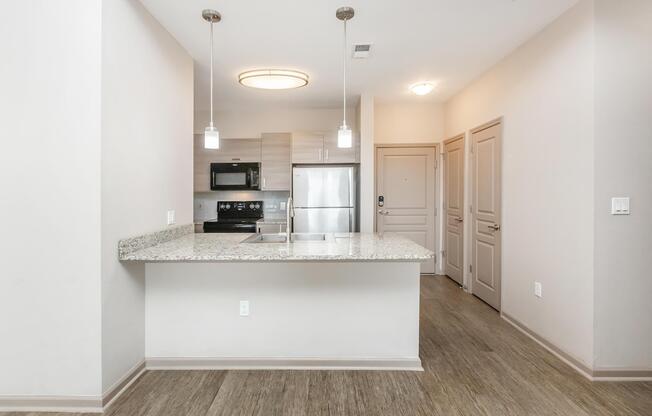 a kitchen with a sink and a mirror