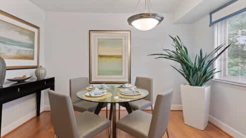 a dining room with a table and chairs