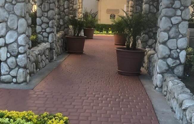 Quaint brick walkway enterance to Northwood Apartments in Upland, California.