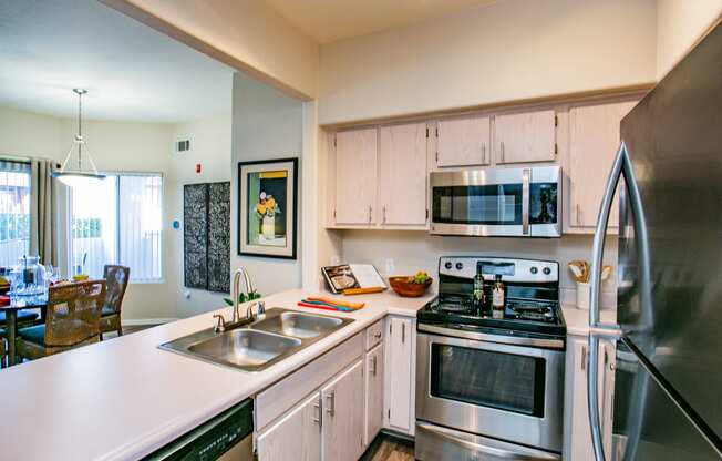Updated kitchen with stainless steel appliances and white counter tops Apartments in Las Vegas