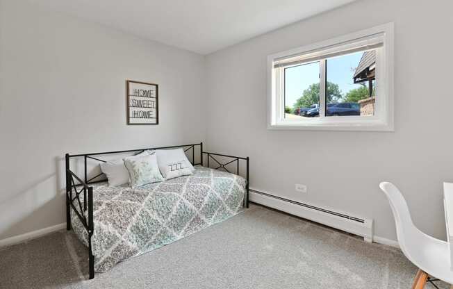 Second bedroom with large window for natural lightat Aspen Ridge Apartments in West Chicago Illinois 60185