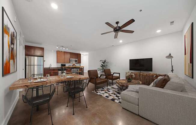 A modern living room with a dining table and chairs at River Mill Lofts & Skyloft in Asheville, NC