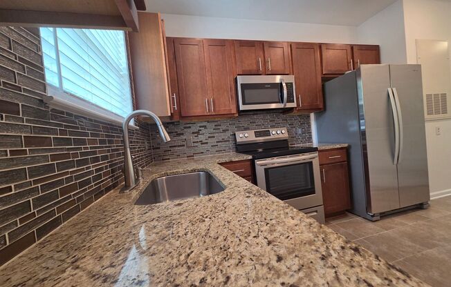 Beautiful 1 Bed/1 Bath Condo - Open Floor Plan - Large Kitchen - Covered Balcony - Community Pool - Secured Building
