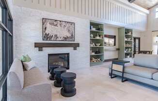 a living room with a couch and a fireplace