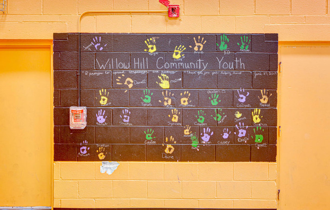 a chalkboard calendar on the wall of a school with the words allied community at Willow Hill Apartments, Justice, 60458