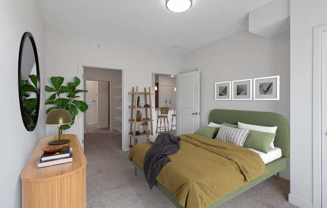 a bedroom with a green bed and a brown blanket