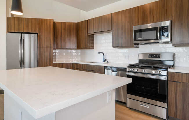 Kitchen with Quartz Countertops and Stainless Steel Appliances