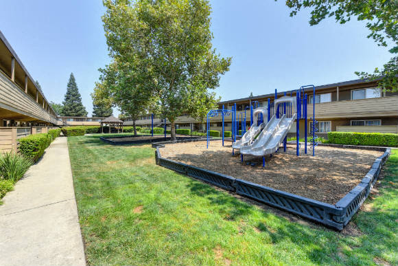  Community Outdoor Playground with Slides, Woodchip Floor and Grass