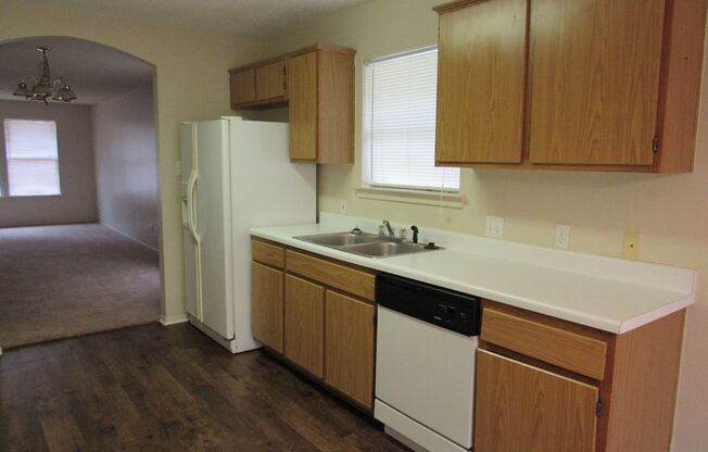 Cozy 3/2/2 one story with fence yard just west of I-35!