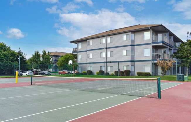 a tennis court with a building in the background  at Shoreline Village, Richland, WA