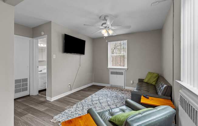 a living room with a couch and a tv