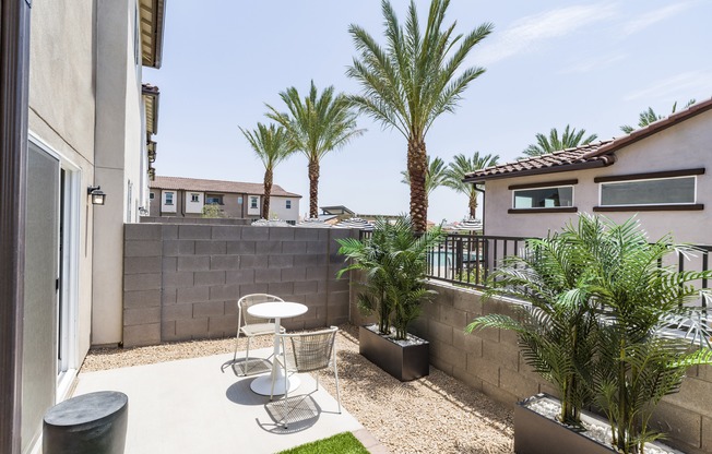 Embrace outdoor living at its finest at Amavi Aster Ridge with your very own fenced backyard featuring turf and a private patio.