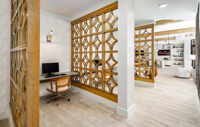 a home office with a desk and a computer in a room