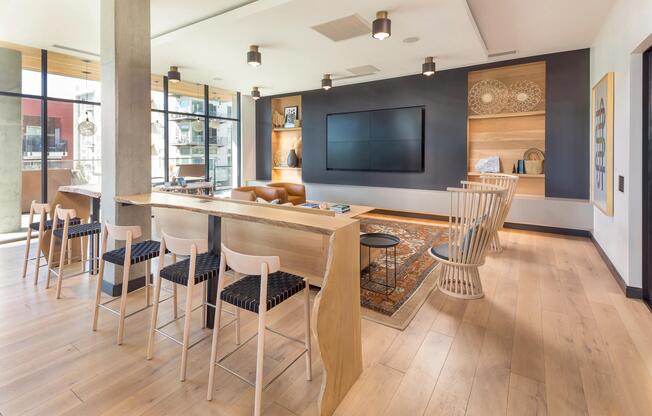 WiFi lounge with large flatscreen TV and coffee bar.