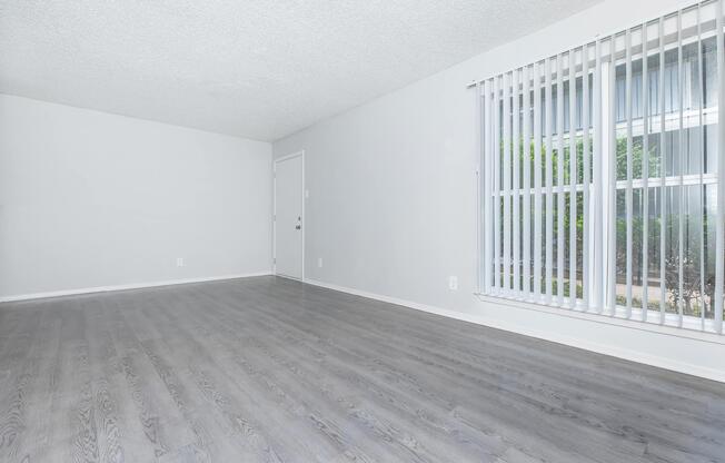 a bedroom with a large window