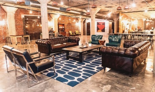 a lobby with couches and chairs and a coffee table