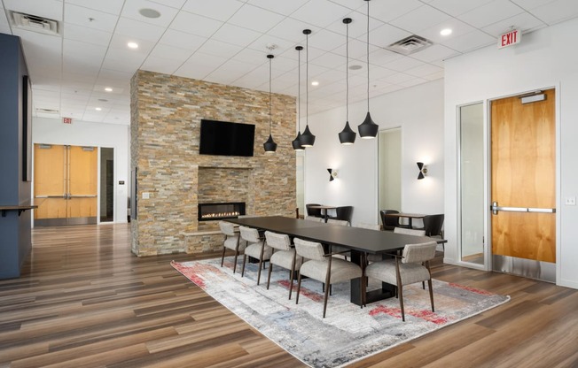 a dining room with a table and chairs and a fireplace