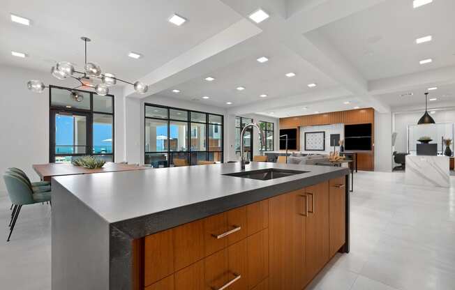 a large kitchen with a large island and a sink