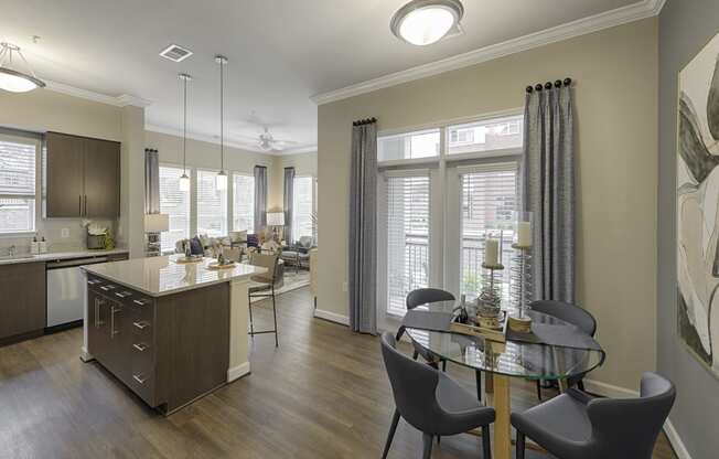 Dining area open to kitchen; door to patio or balcony