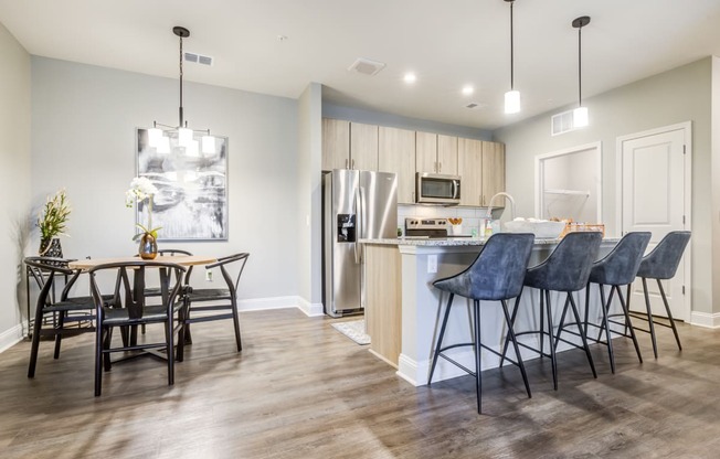 a kitchen and dining area in a 555 waverly unit