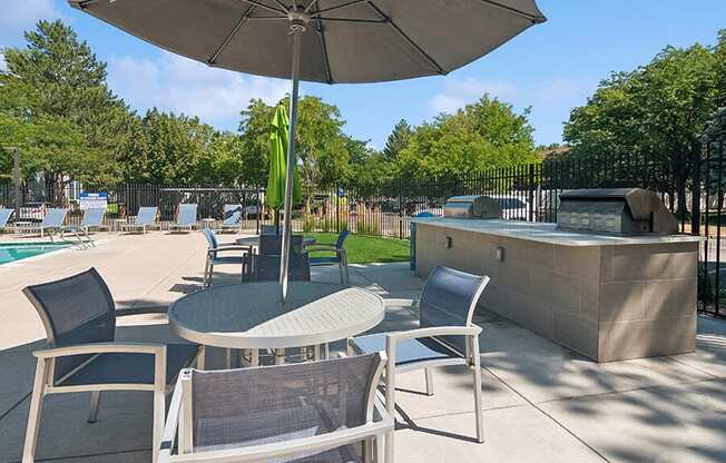 Outdoor BBQ Area with Furniture at Overlook Apartments located in Salt Lake City, UT.