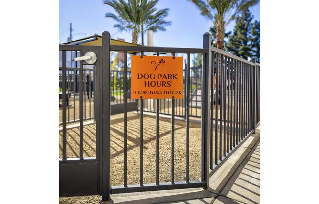 a sign on the side of a fence