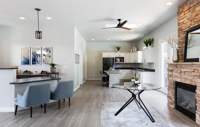 A modern kitchen with a dining table and chairs.