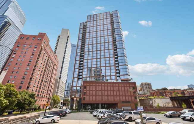 a parking lot in front of a tall building in the city at Cassidy on Canal, Chicago, IL