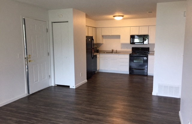 bright white clean cabinets, wood flooring, lots of storage at regency apartments in Bettendorf Iowa