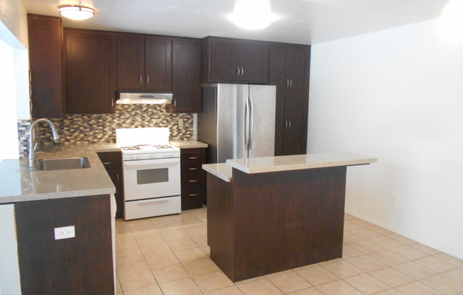 Pet Friendly 4 Bedroom Home with Fenced Back Yard!