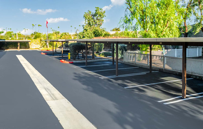 an empty parking lot with a covered parking lot