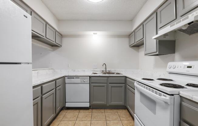 a kitchen with a stove top oven