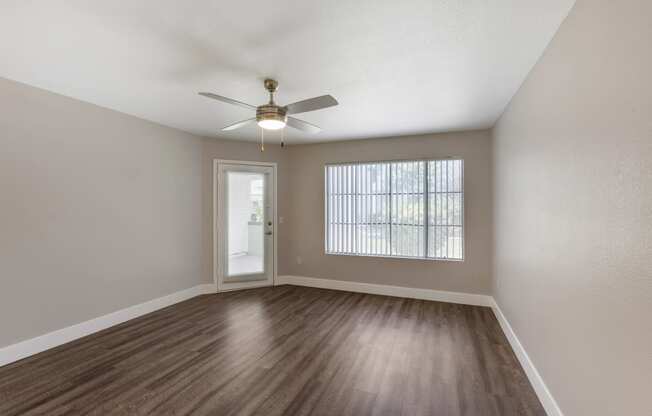 A welcoming living space with direct access to a serene patio or balcony at Boulders at Lookout Mountain Apartment Homes, Phoenix Arizona