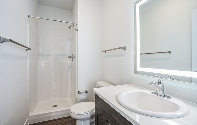 a bathroom with a sink toilet and shower at Meadowbrooke Apartment Homes, Grand Rapids, Michigan