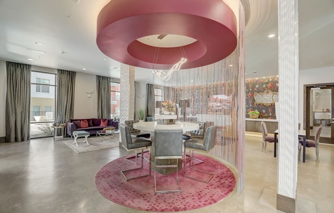 a dining area with a table and chairs in a lobby