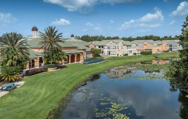 a building with a pond in front of it, Henley Tampa Palms, Tampa, FL
