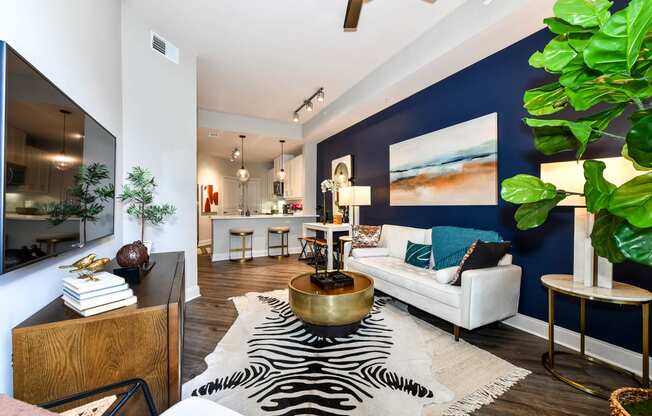 a living room with a blue accent wall