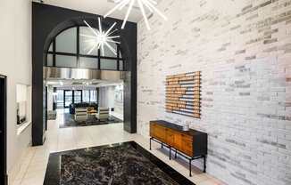 A modern living room with a black and white color scheme.
